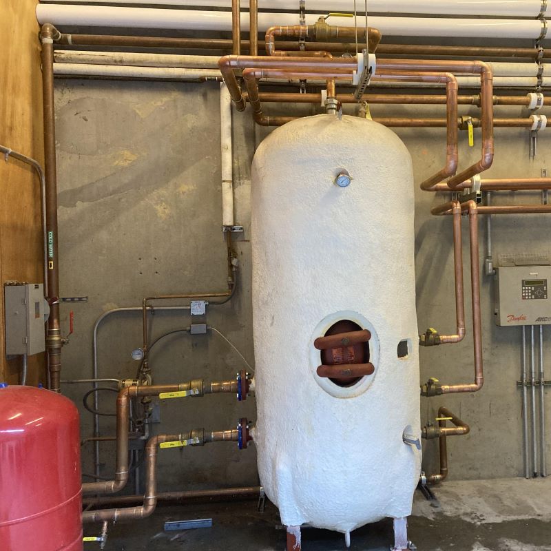 Custom-built modular pump skid system with integrated instrumentation for sanitary fluid handling.