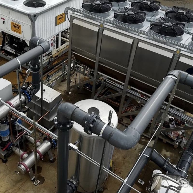 Integrated process skid system showing complex industrial piping and equipment for modular modular construction.